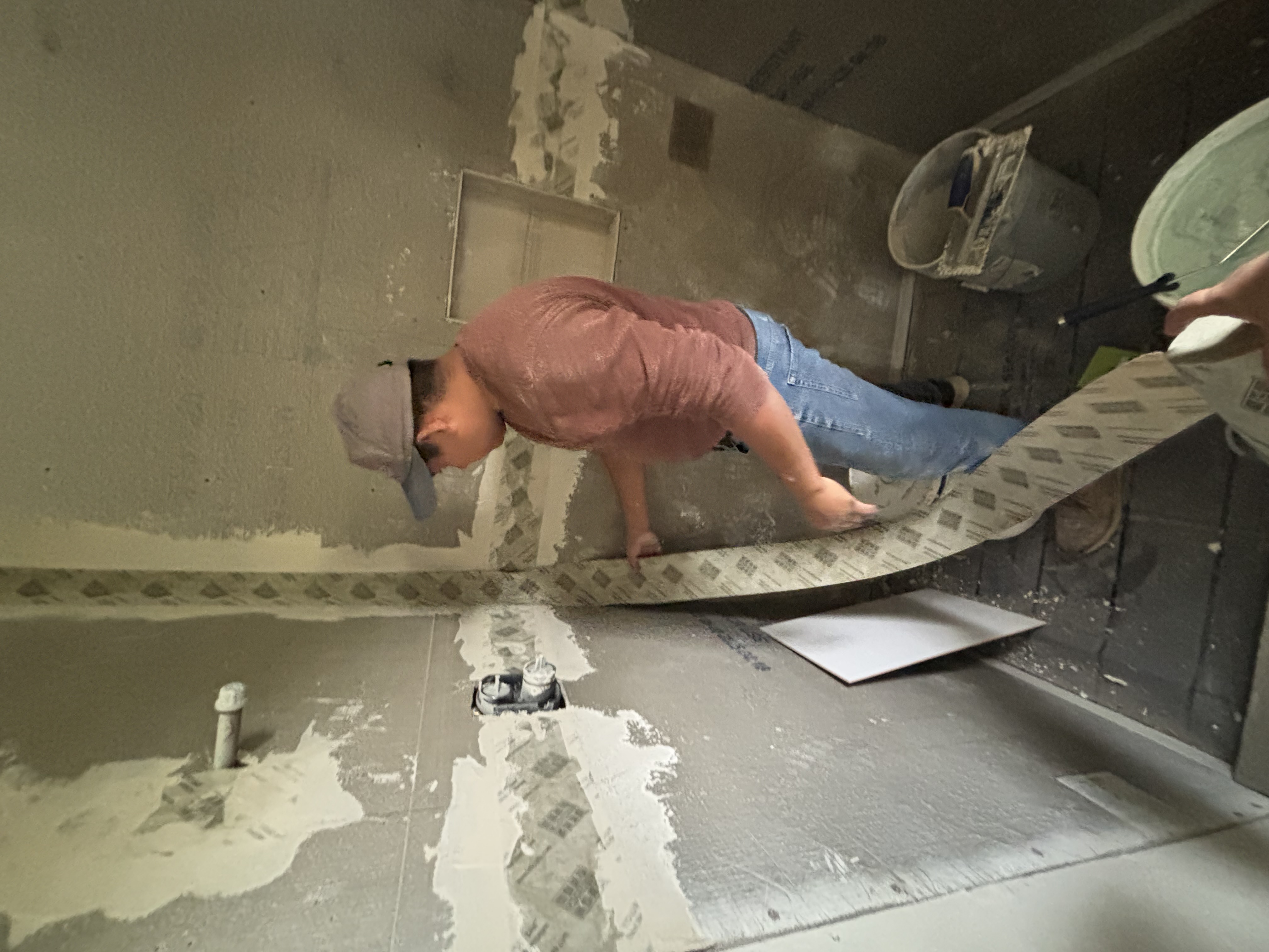 A Gutierrez Flooring installer adding drywall seams during a remodel.